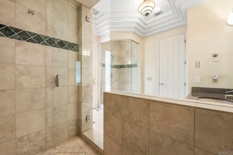 a view of a house with wooden fence