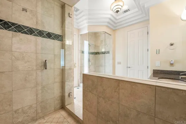 a view of a house with wooden fence