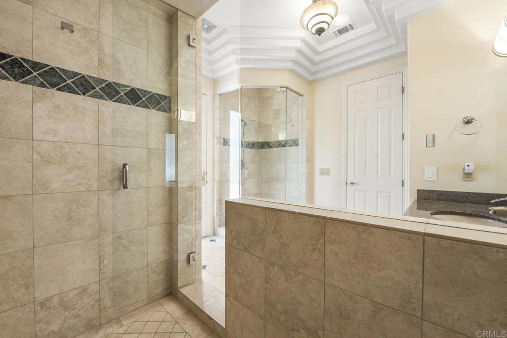 15615 Boulder Ridge Lane Poway, CA 92064 - Photo 35 of 75 a bathroom with a bathtub and shower