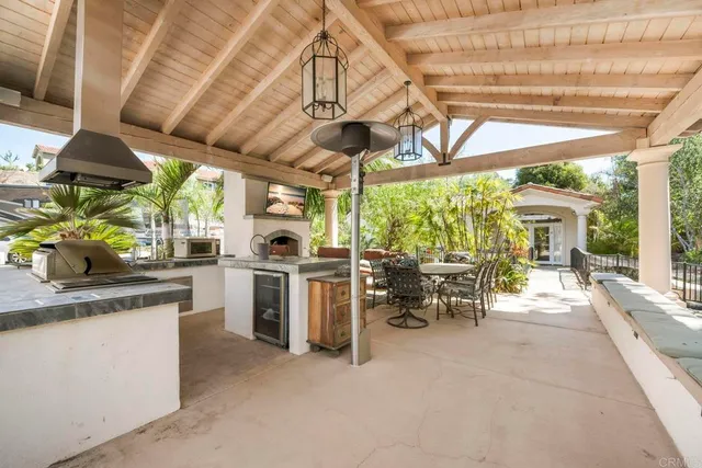 a view of a house with a backyard porch and sitting area