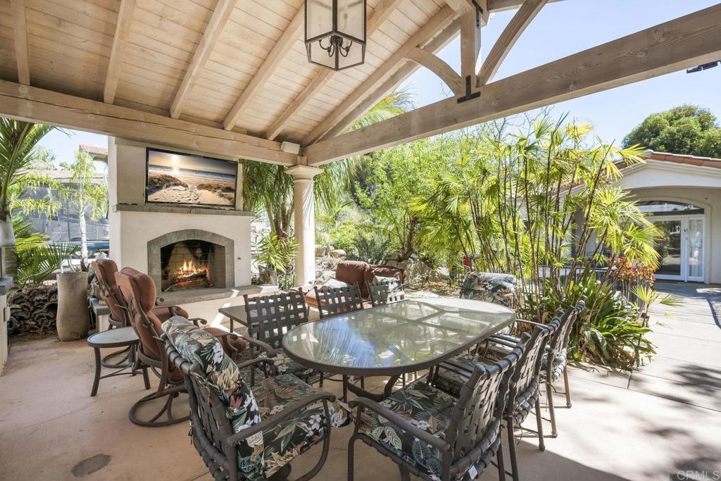 15615 Boulder Ridge Lane Poway, CA 92064 - Photo 43 of 75 a dinning table and chairs in a patio