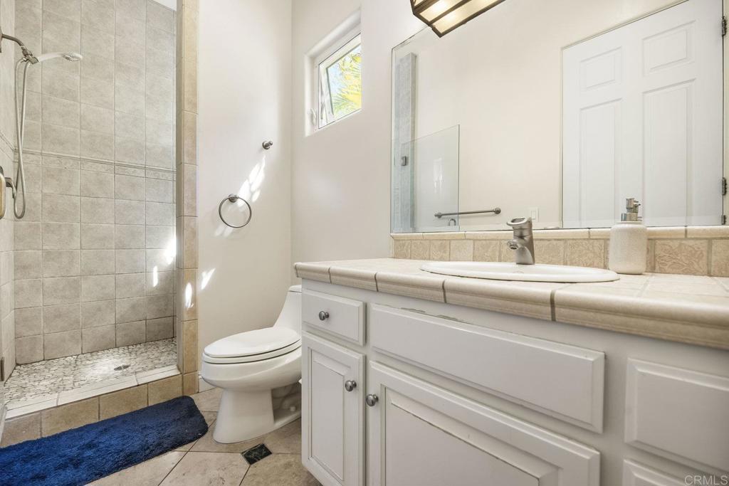 15615 Boulder Ridge Lane Poway, CA 92064 - Photo 50 of 75 a bathroom with a sink and a mirror