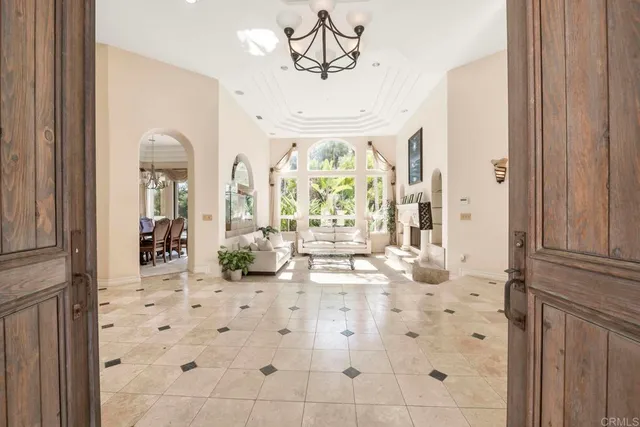 a view of a dining room with furniture large windows and wooden floor