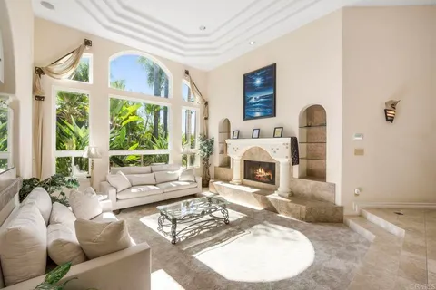 a kitchen with stainless steel appliances kitchen island granite countertop a refrigerator and cabinets