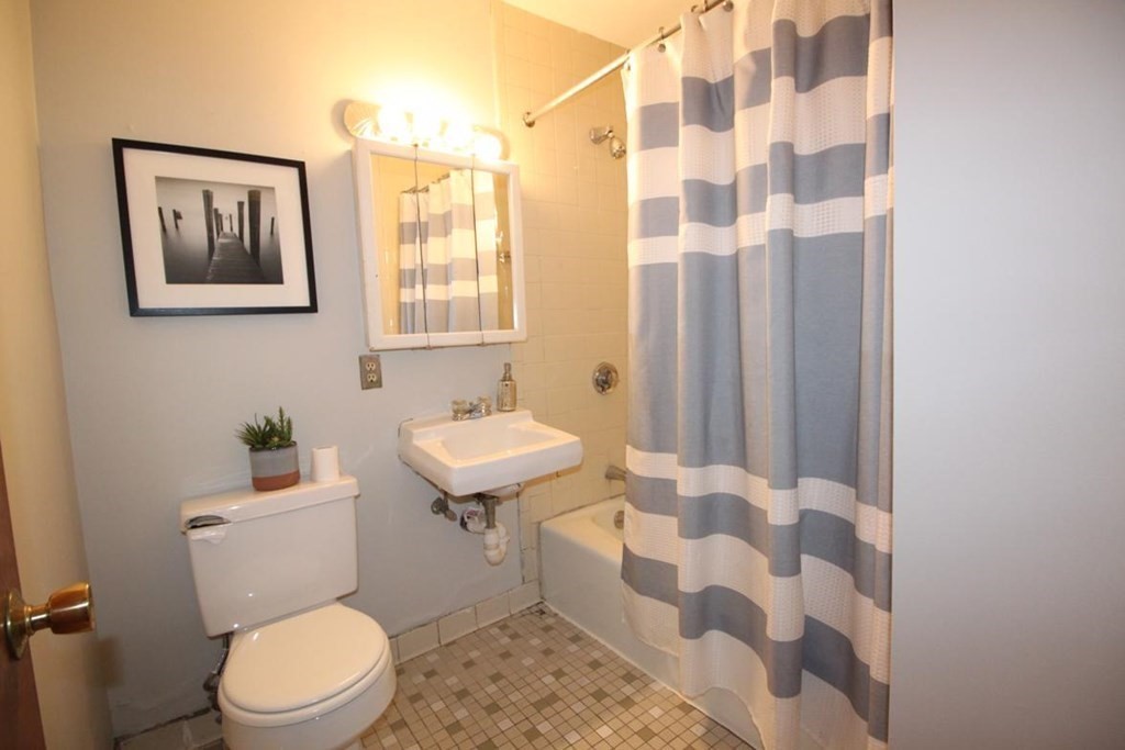 3 Appleton Street, Unit 502 Boston, MA 02116 - Photo 11 of 14 a bathroom with a sink toilet and shower