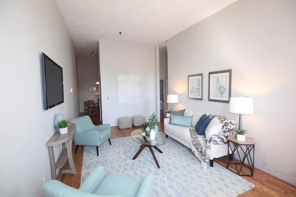3 Appleton Street, Unit 502 Boston, MA 02116 - Photo 2 of 14 a living room with furniture and a lamp