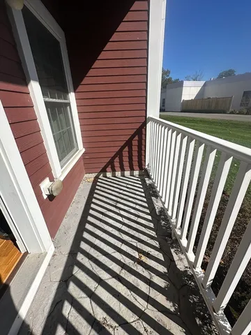 a view of a balcony with staircase