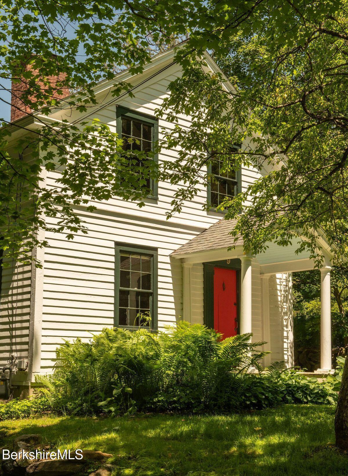 a view of a house with a yard and plants