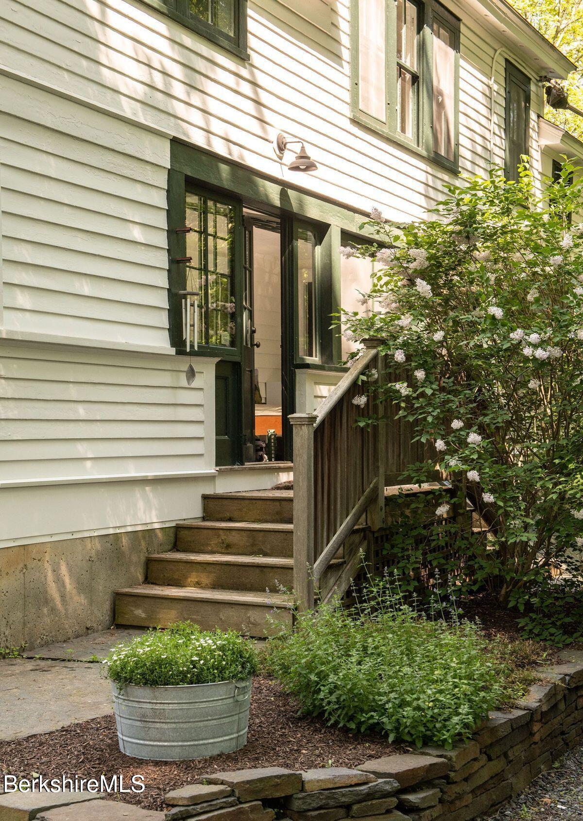 9 Yale Hill Road Stockbridge, MA 01262 - Photo 27 of 29 a view of a house with a small yard and wooden floor and fence