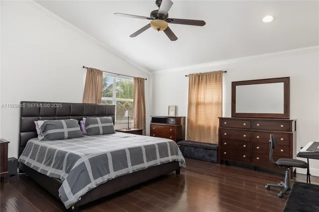 a view of walk in closet with clothes