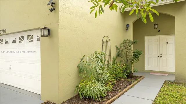 a large kitchen with stainless steel appliances granite countertop a stove refrigerator a oven a sink dishwasher and wooden cabinets with wooden floor