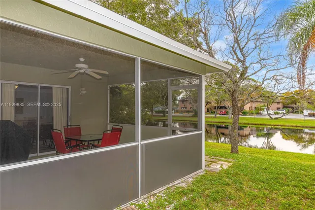 an aerial view of residential house with outdoor space and lake view