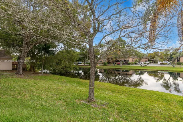 an aerial view of a house with outdoor space lake and lake view