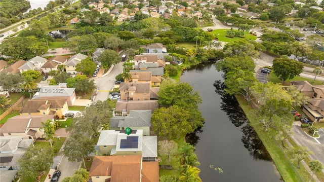 an aerial view of a pool patio swimming pool and outdoor seating