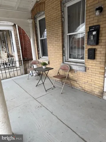 a view of two chairs in the patio