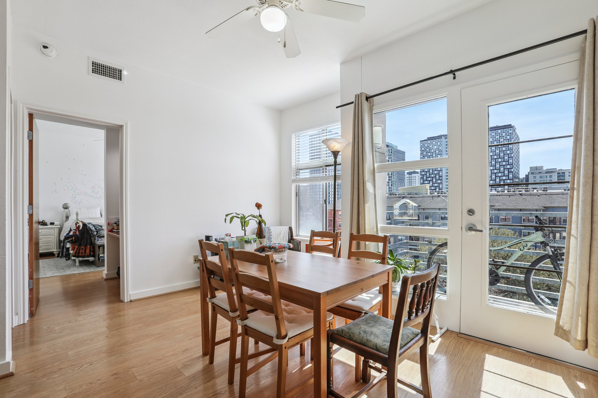 711 West 26th Street, Unit 704 Austin, TX 78705 - Photo 12 of 32 a dining room with furniture and window