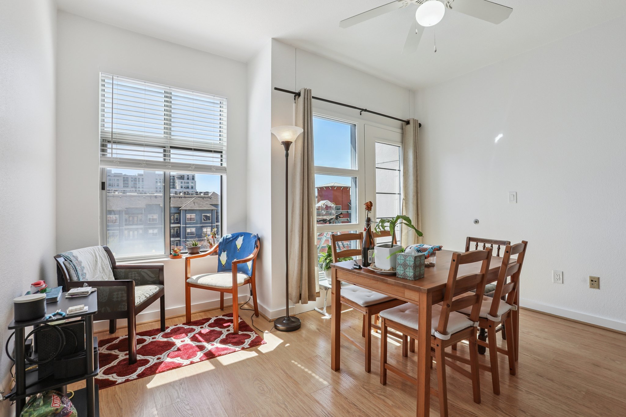 711 West 26th Street, Unit 704 Austin, TX 78705 - Photo 14 of 32 a view of a dining room with furniture wooden floor and a chandelier