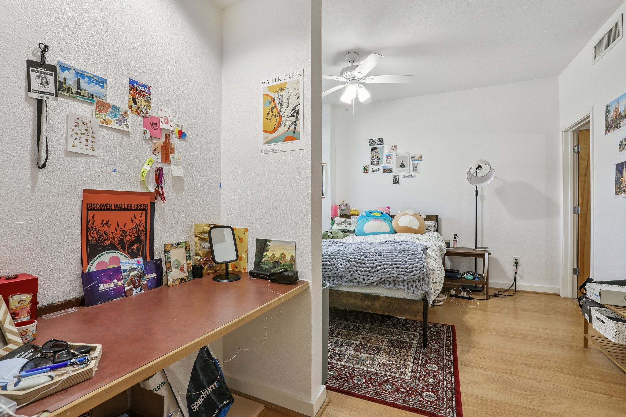 711 West 26th Street, Unit 704 Austin, TX 78705 - Photo 17 of 32 a bedroom with a bed and wooden floor