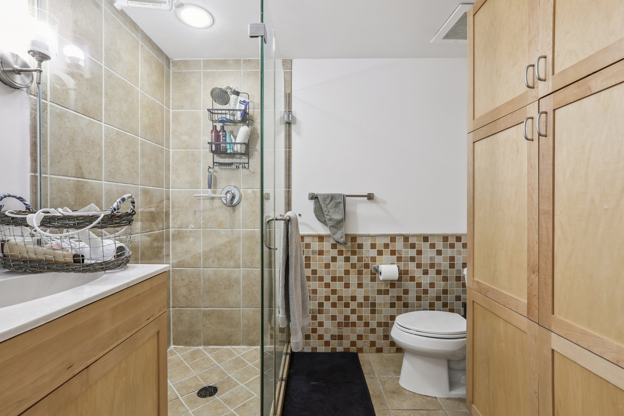 711 West 26th Street, Unit 704 Austin, TX 78705 - Photo 21 of 32 a bathroom with a sink a toilet and shower