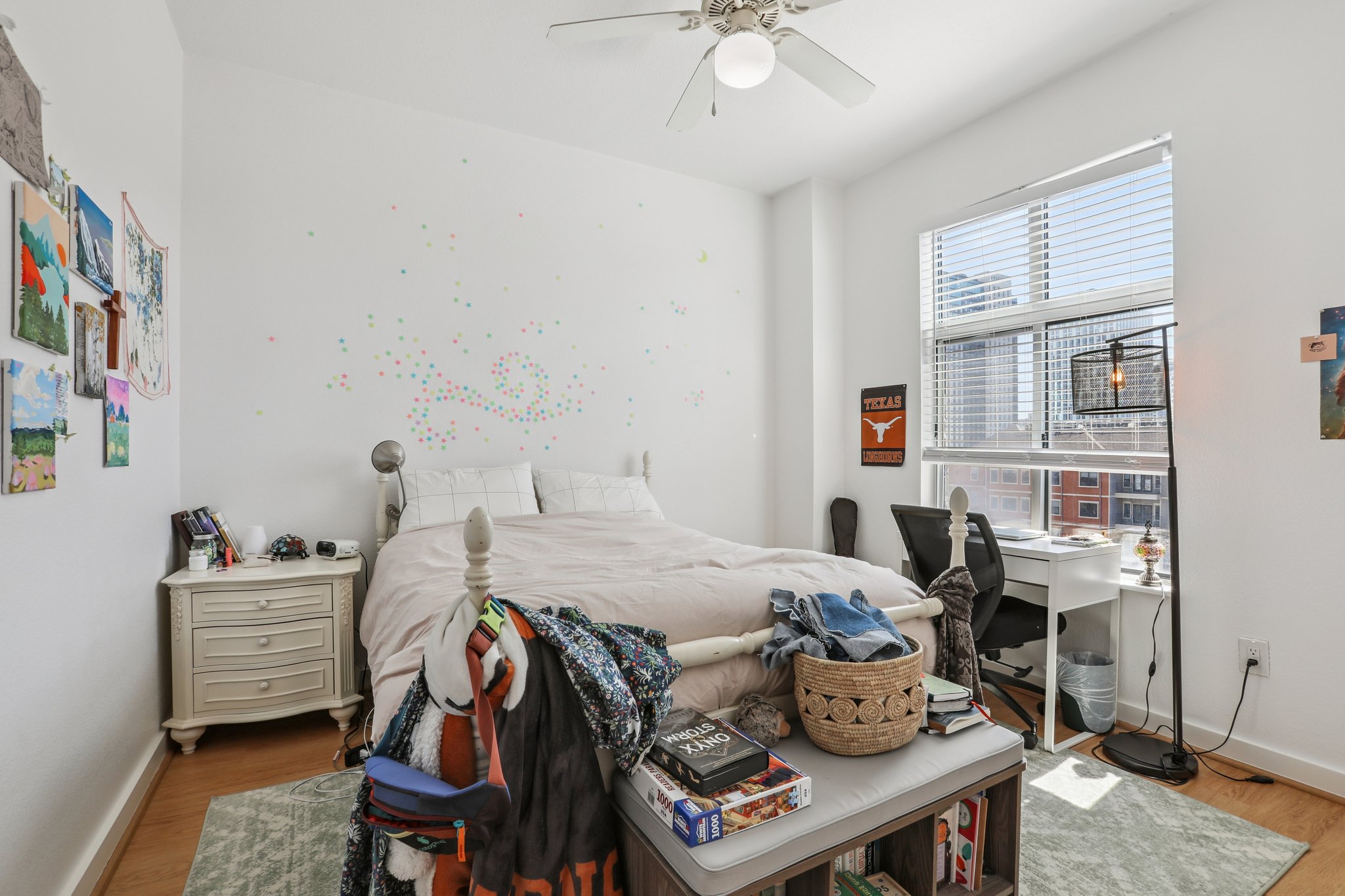 711 West 26th Street, Unit 704 Austin, TX 78705 - Photo 22 of 32 a bedroom with furniture and a window