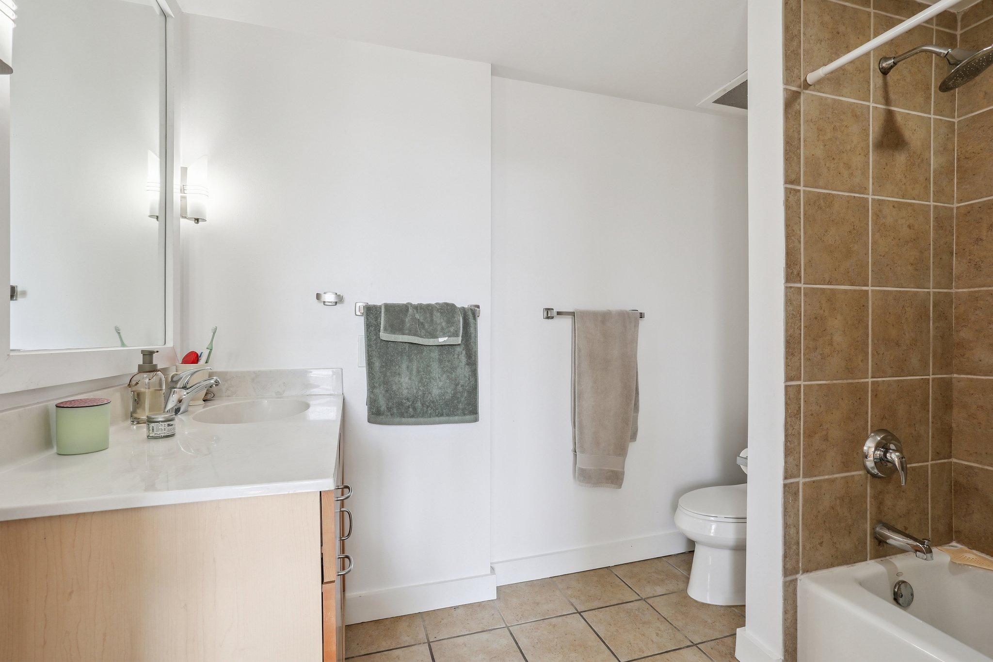 711 West 26th Street, Unit 704 Austin, TX 78705 - Photo 25 of 32 a bathroom with a sink toilet and shower