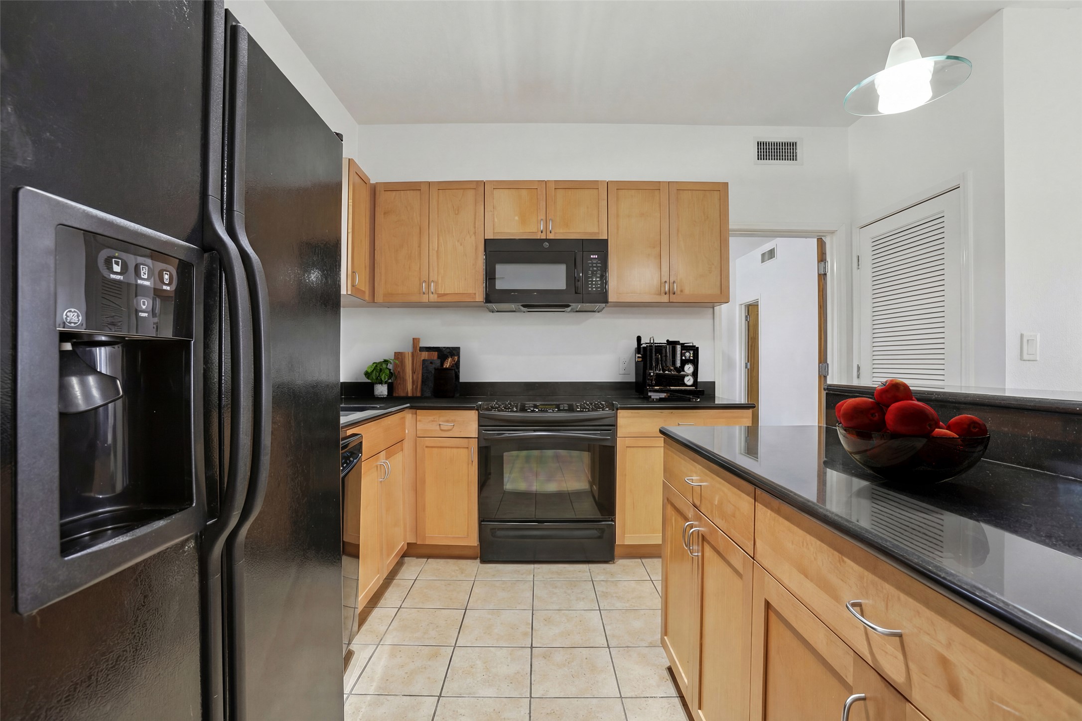 711 West 26th Street, Unit 704 Austin, TX 78705 - Photo 4 of 32 a kitchen with a refrigerator and a sink