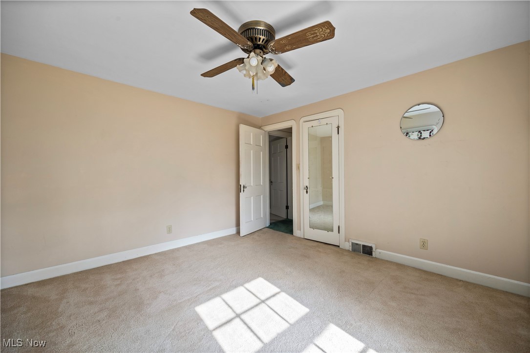 976 Gulf Road Elyria, OH 44035 - Photo 33 of 43 Unfurnished bedroom featuring light colored carpet and a ceiling fan