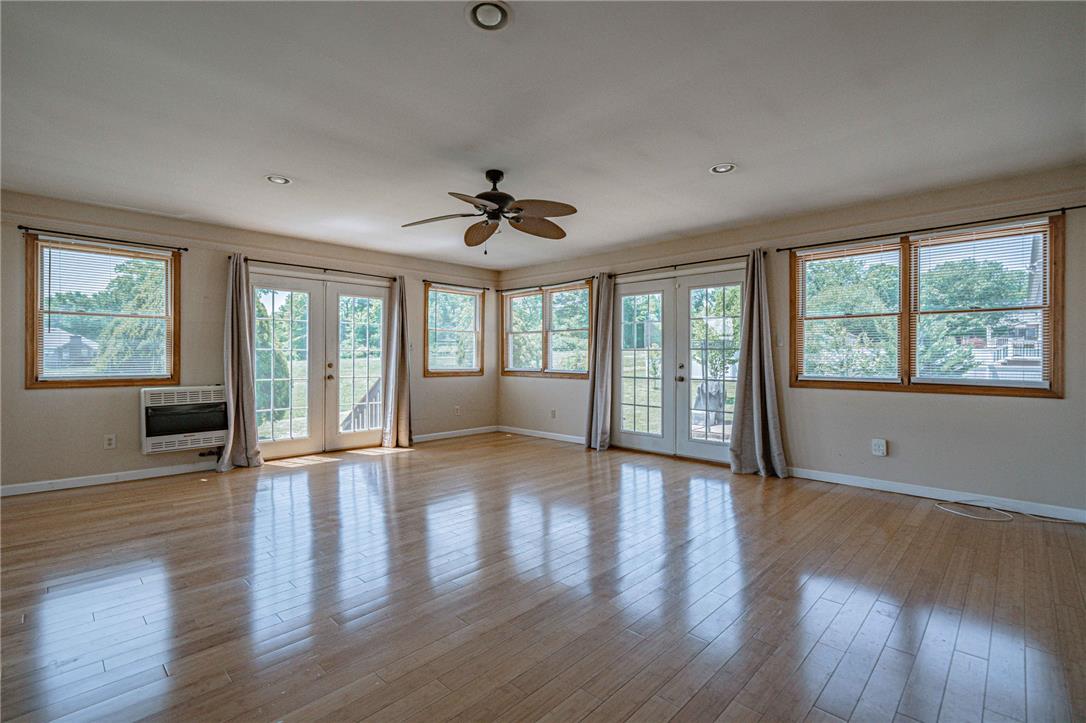 652 Old State Road Oley, PA 19547 - Photo 26 of 54 Hardwood floors and generous natural light define this inviting interior space.
