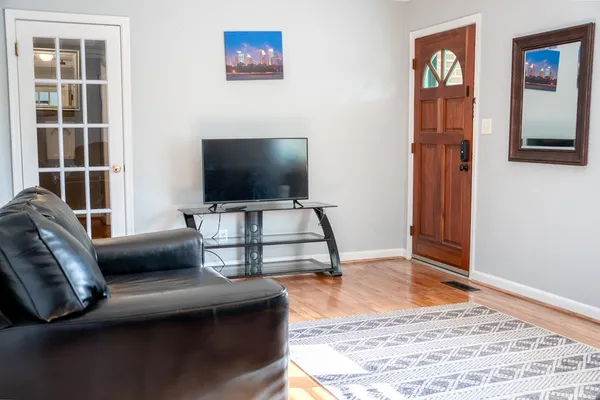 a living room with furniture and a flat screen tv
