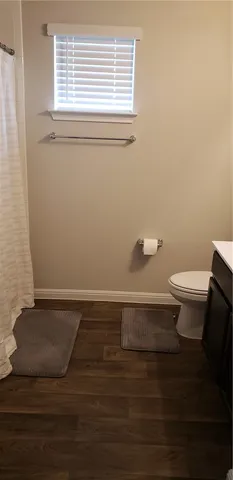 a bathroom with a toilet and a sink