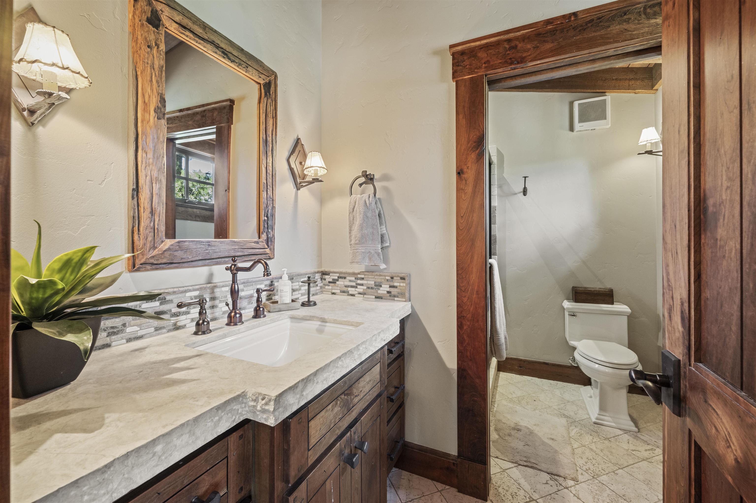 13123 Snowshoe Thompson Circle Truckee, CA 96161 - Photo 13 of 23 a bathroom with a sink and a mirror