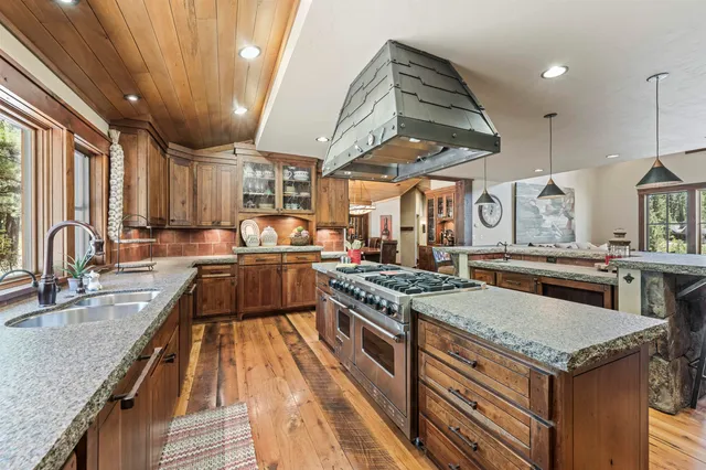 a kitchen with a stove and a sink