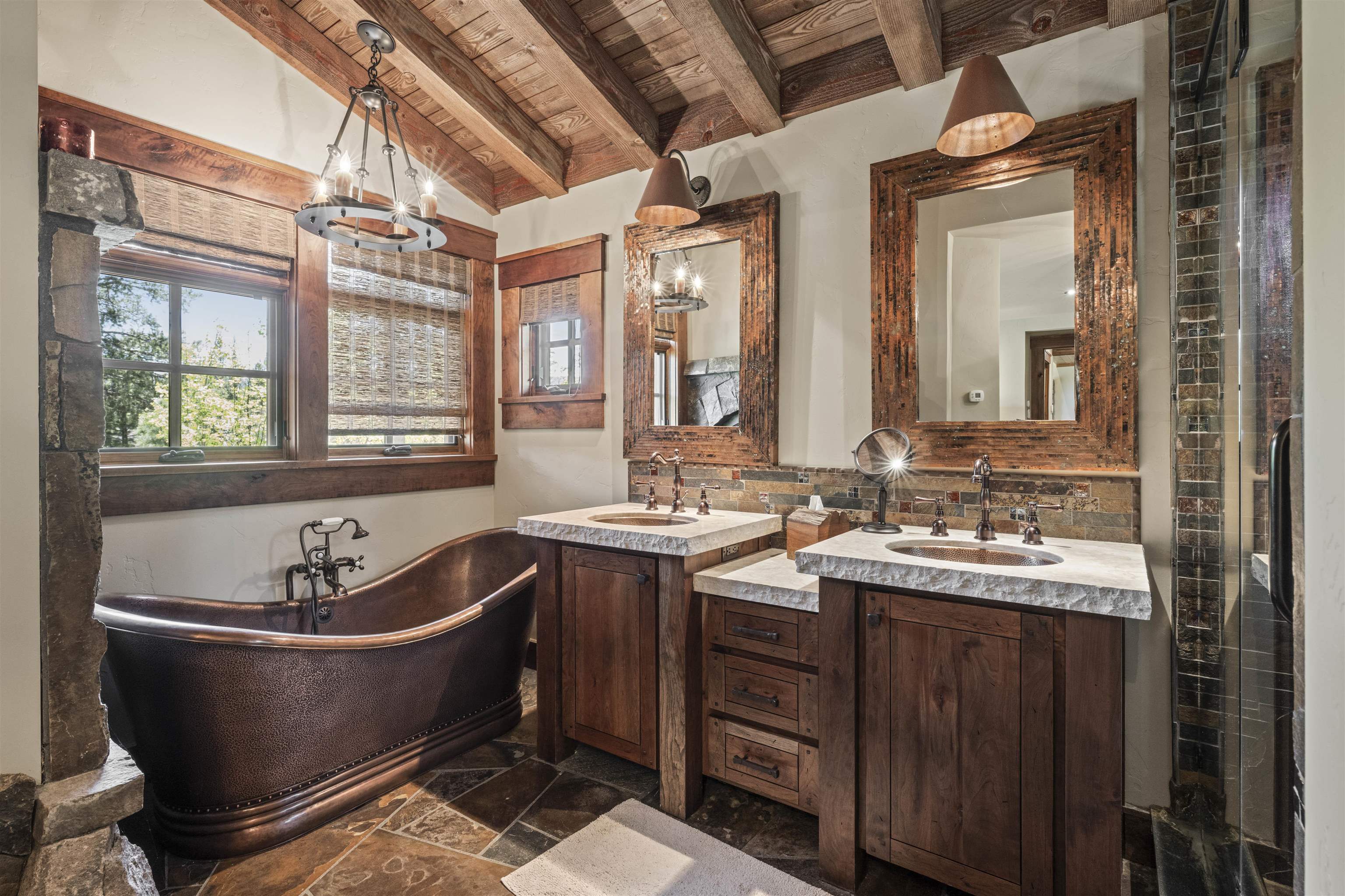 13123 Snowshoe Thompson Circle Truckee, CA 96161 - Photo 10 of 23 a bathroom with a bathtub sink and mirror