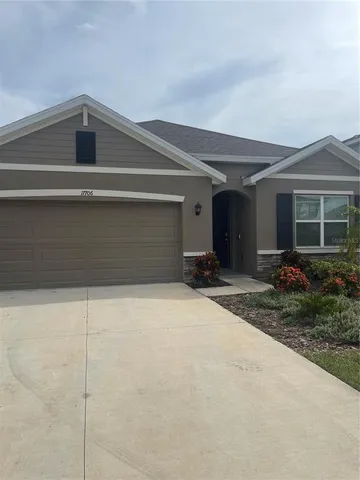 a view of backyard and hardwood