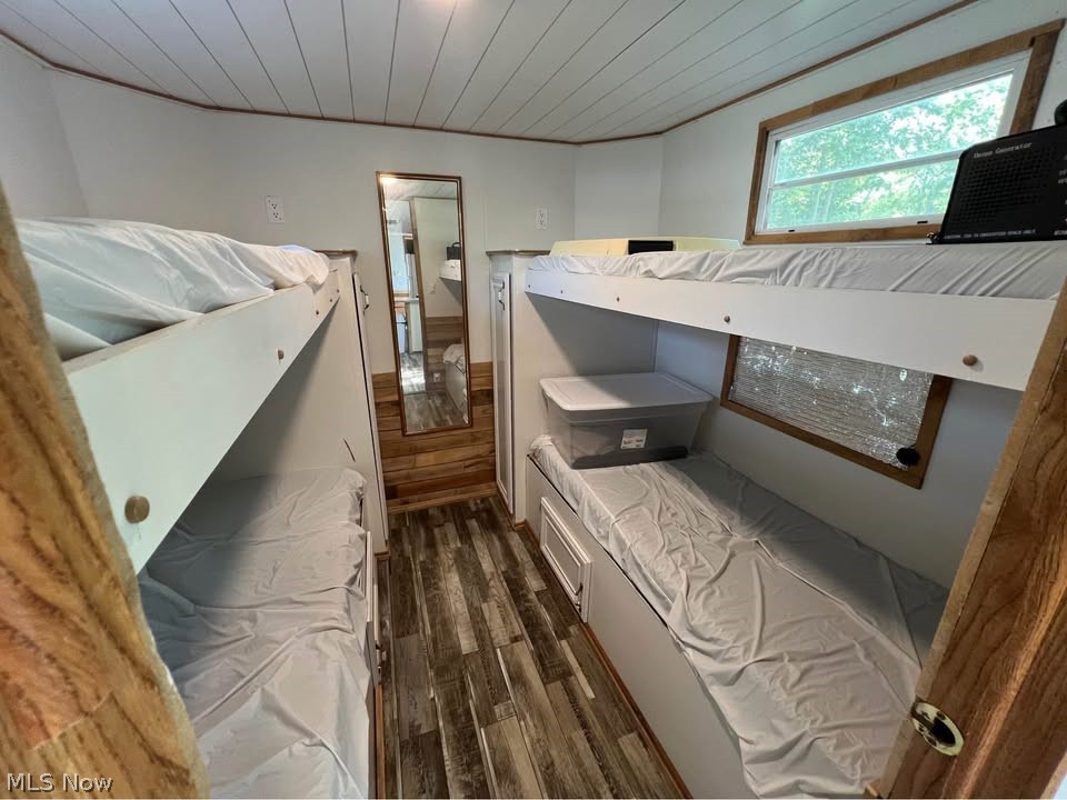 6684 Leon Road, Unit 336 Andover, OH 44003 - Photo 10 of 10 Bedroom featuring dark wood-style floors and wooden ceiling