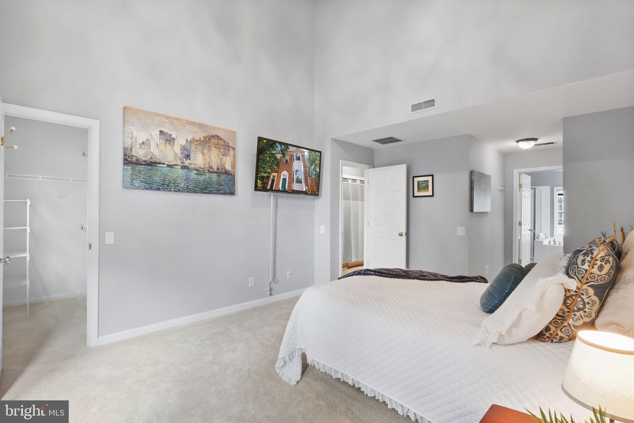 6038 Lincolnia Road Alexandria, VA 22312 - Photo 15 of 31 a bedroom with a bed and a painting on the wall