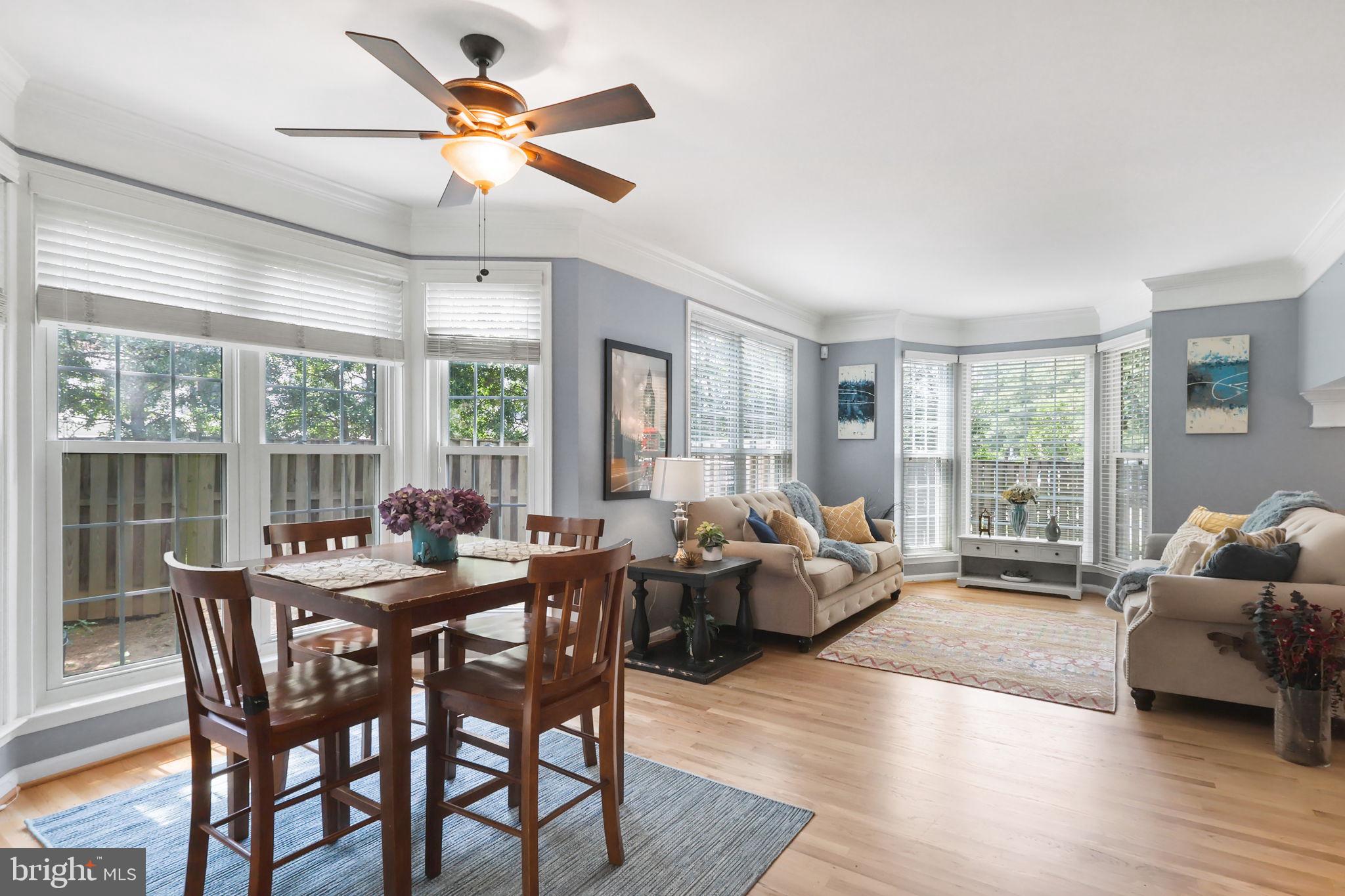 6038 Lincolnia Road Alexandria, VA 22312 - Photo 4 of 31 a living room with furniture ceiling fan and a window