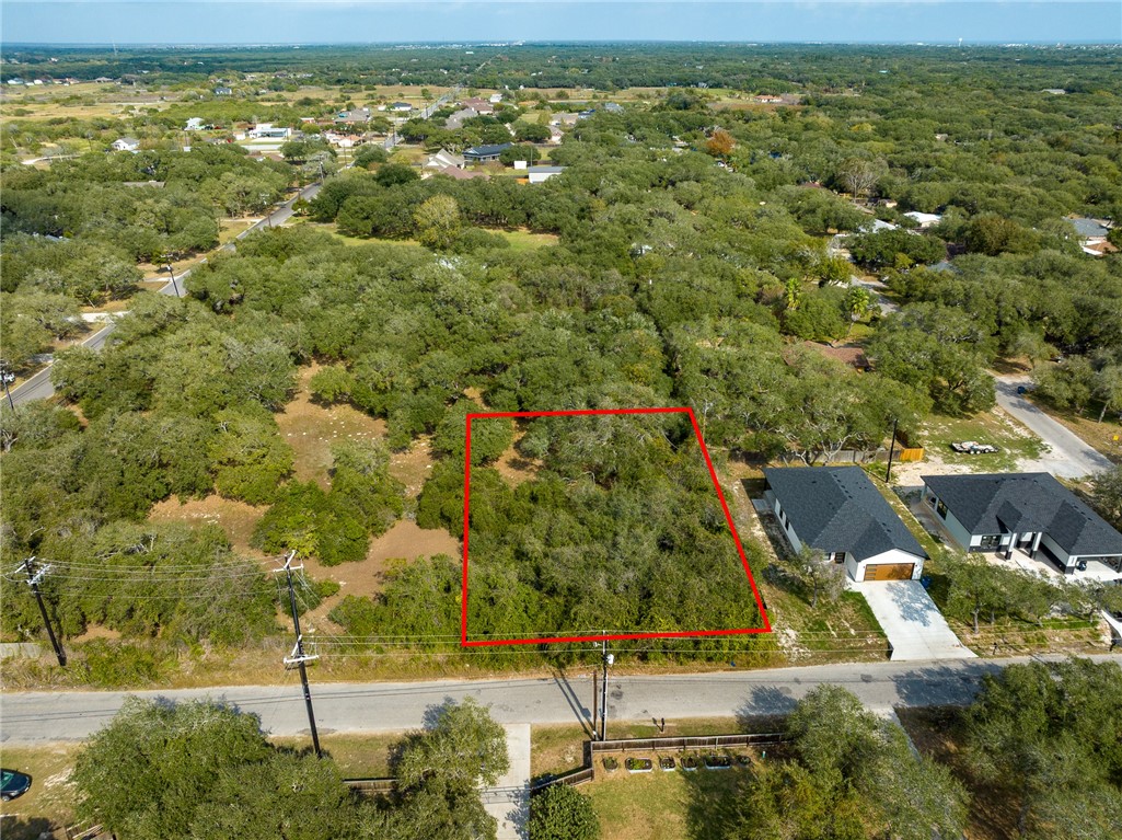 Lot 4 Indian Ingleside, TX 78362 - Photo 1 of 14 an aerial view of residential houses with outdoor space and trees
