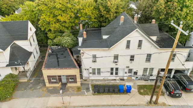 a view of multiple houses with outdoor kitchen