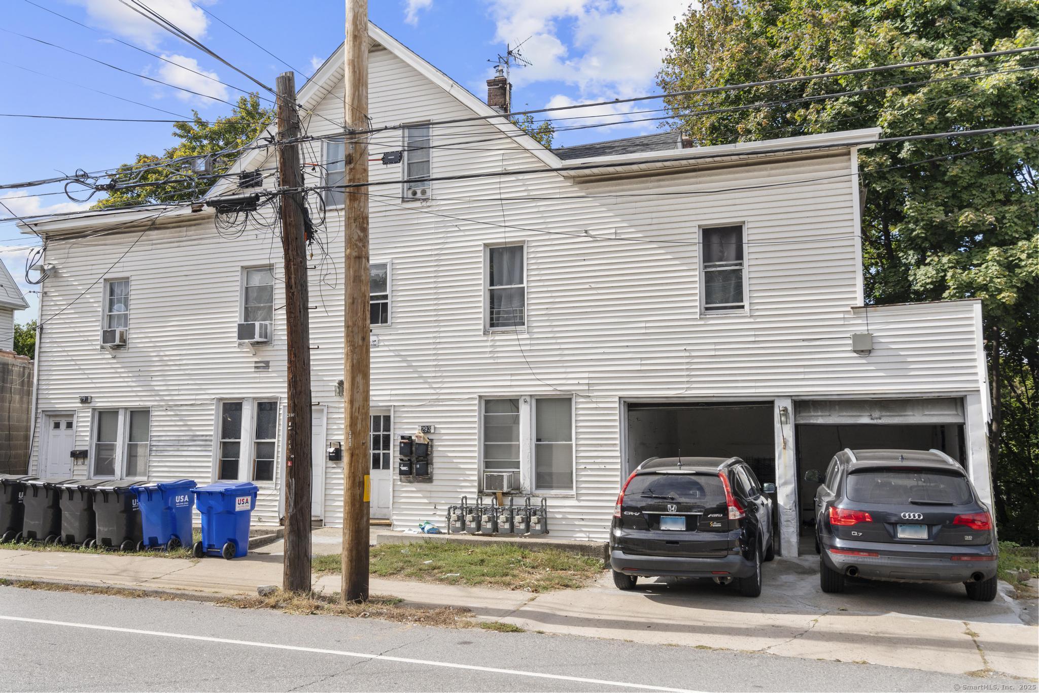 291 East Main Street Torrington, CT 06790 - Photo 7 of 12 a view of a car parked in front of a house