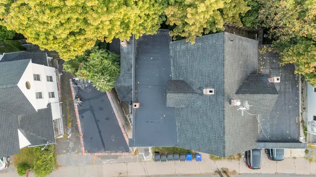 an aerial view of residential houses with outdoor space