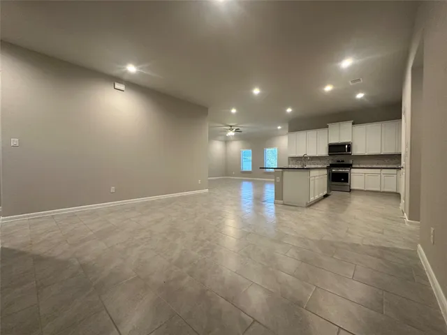 a view of a kitchen with a stove and a window