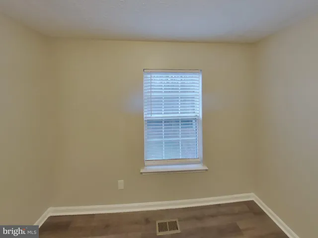 a bathroom with a sink a mirror and shower
