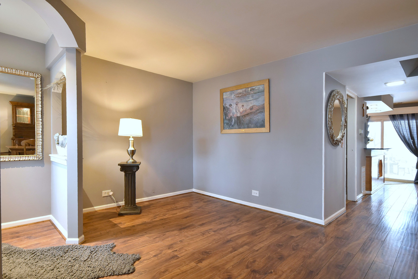 260 Rodenburg Road Roselle, IL 60172 - Photo 24 of 39 an empty room with wooden floor and windows