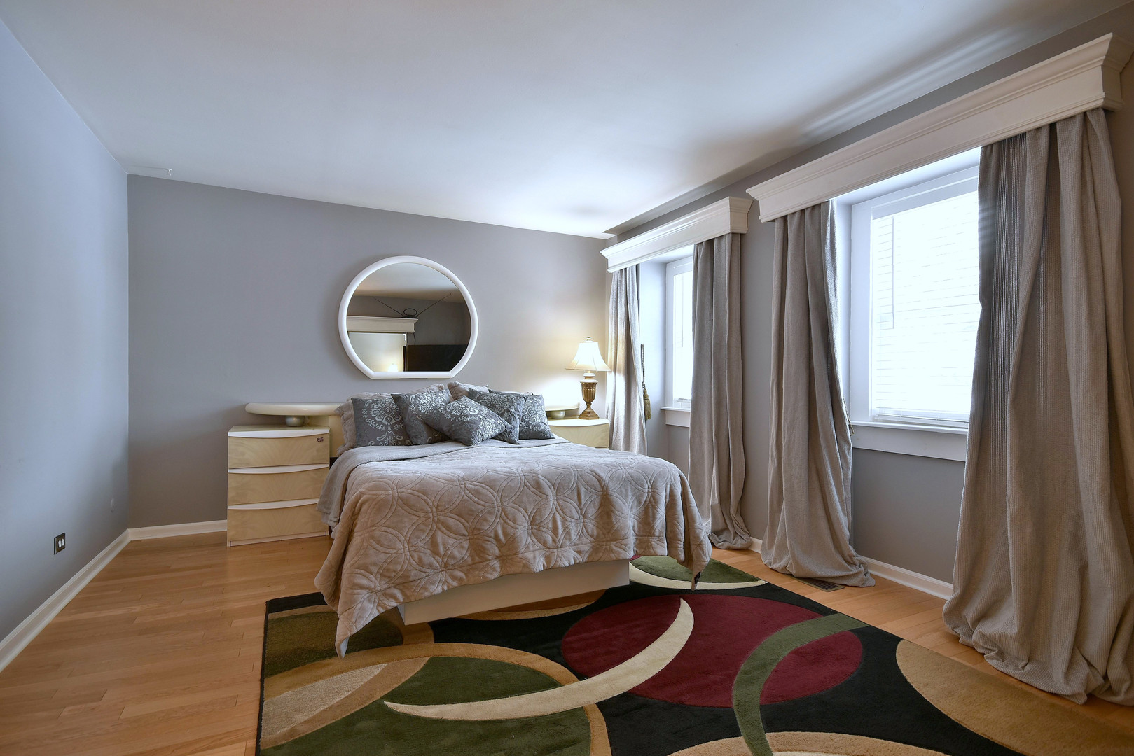 260 Rodenburg Road Roselle, IL 60172 - Photo 7 of 39 a bedroom with a bed and a mirror