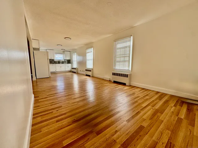 a view of a livingroom with wooden floor