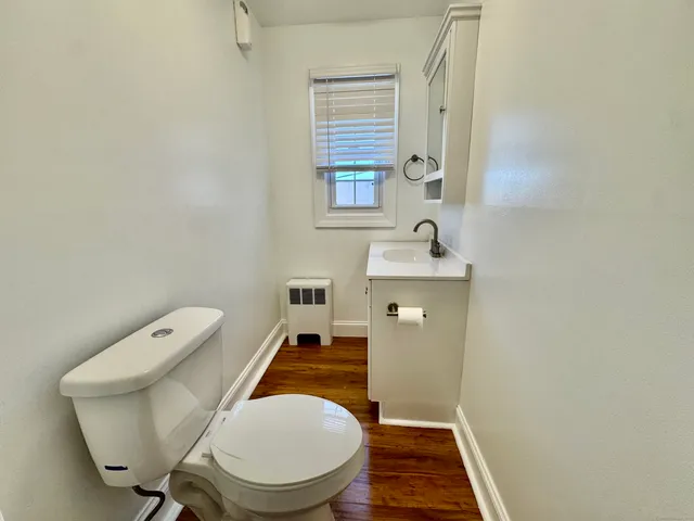 a bathroom with a toilet and a sink