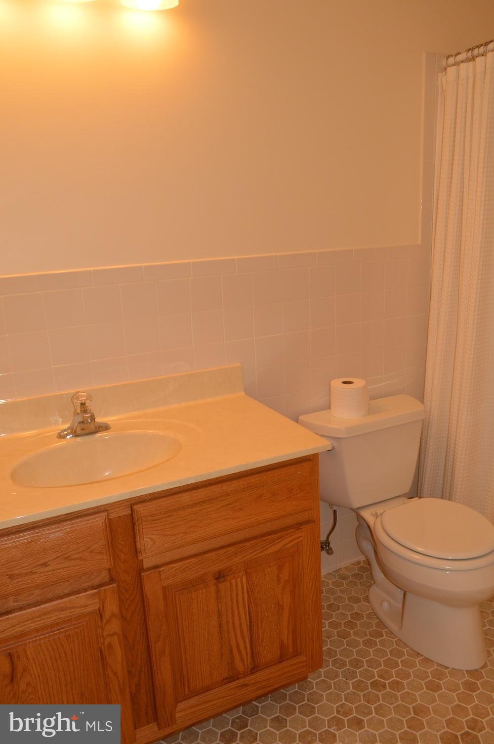 9064 Centerway Road Gaithersburg, MD 20879 - Photo 14 of 19 a bathroom with a toilet and a vanity