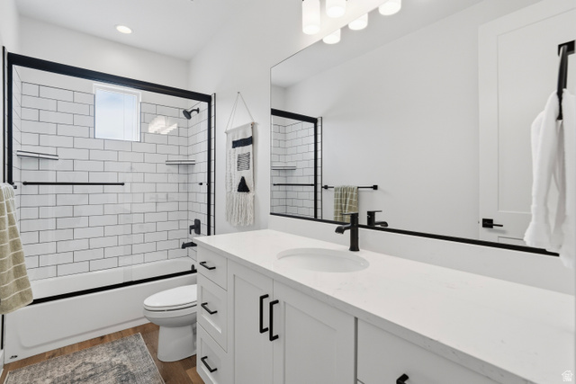 2278 Tawny Ridge Circle St. George, UT 84790 - Photo 45 of 61 White subway tile shower surround with black-framed glass enclosure.