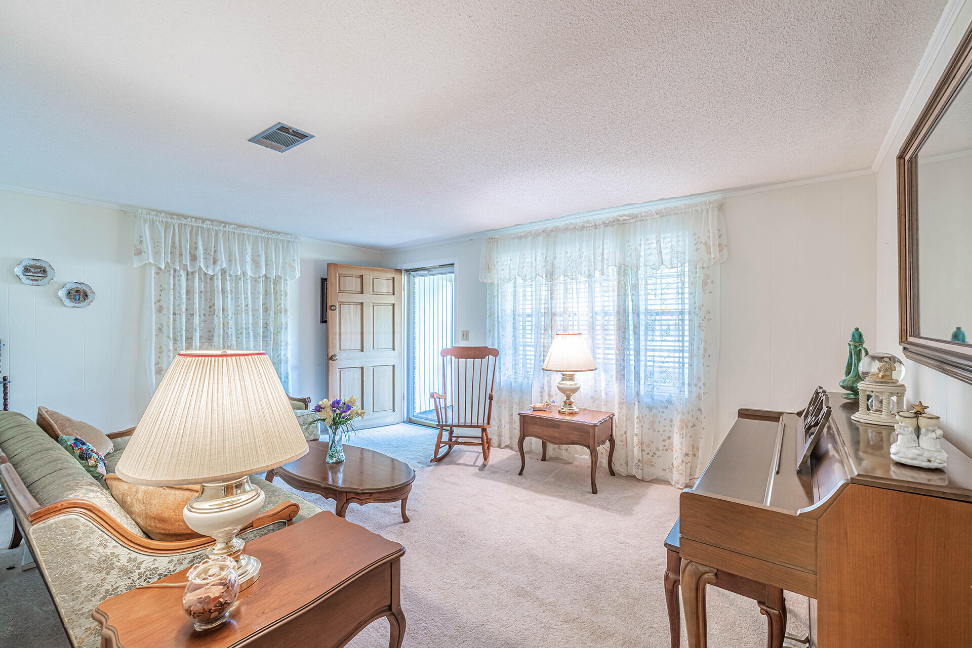 1709 Valparaiso Boulevard Niceville, FL 32578 - Photo 16 of 33 a living room with furniture and a window